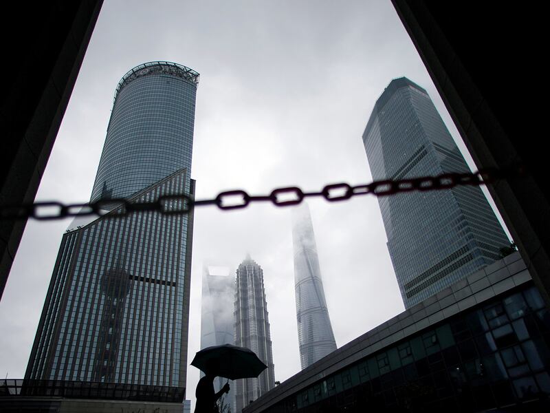 A man walks in Lujiazui financial district in Pudong in Shanghai, China Sept. 17, 2020.