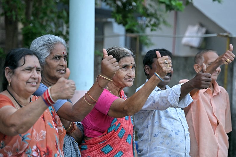 Villagers celebrate the election of Donald Trump inside a temple in Vadluru, the ancestral village of the parents of Usha Vance, wife of vice presidential nominee J.D. Vance, in the West Godavari district in India's Andhra Pradesh state on Nov. 6, 2024.