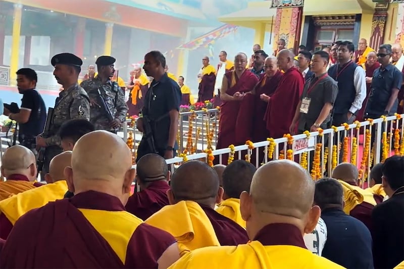 The Dalai Lama, center, is guarded by the Central Reserve Police Force in Hunsur, Karmataka, India, Feb. 18, 2025.