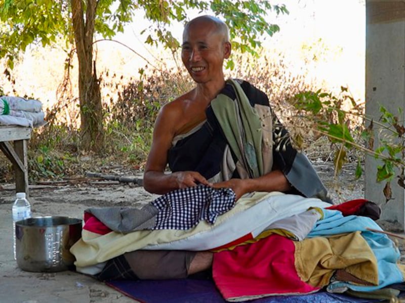 Vietnamese monk Thich Minh Tue prepares to take a nap in Thailand, during his walk to India, Jan. 1, 2025.