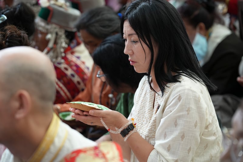 A Tibetan monk listens during celebrations on the 90th birthday of the Dalai Lama at the Main Temple in Dharamsala, India, July 6, 2025.